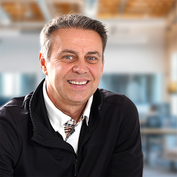 Barber 1 young man with beard smiling and wearing a  brown shirt