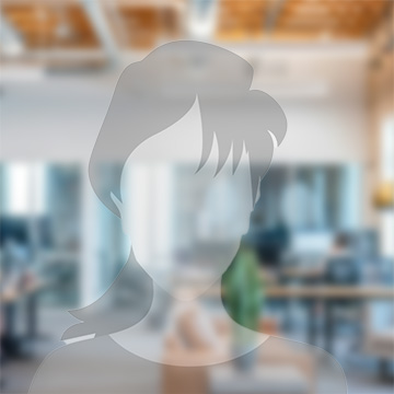 Young man with dark hair and beard, brown eyes, blue t-shirt